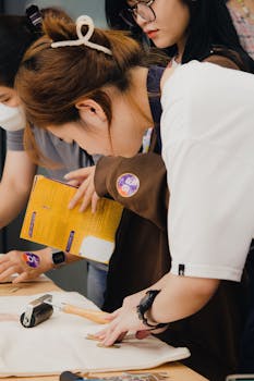 Participants engaging in a DIY craft workshop in Cần Thơ, Việt Nam, using various tools and materials.