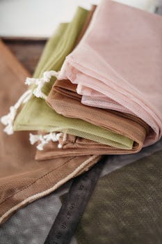 Stack of colorful reusable mesh bags promoting zero waste eco-friendly lifestyle.